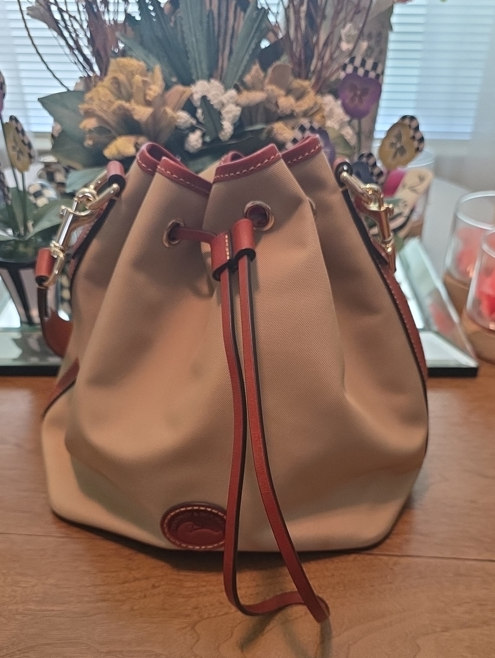 Dooney & Bourke Tan Canvas Bucket Bag with Brown Trim